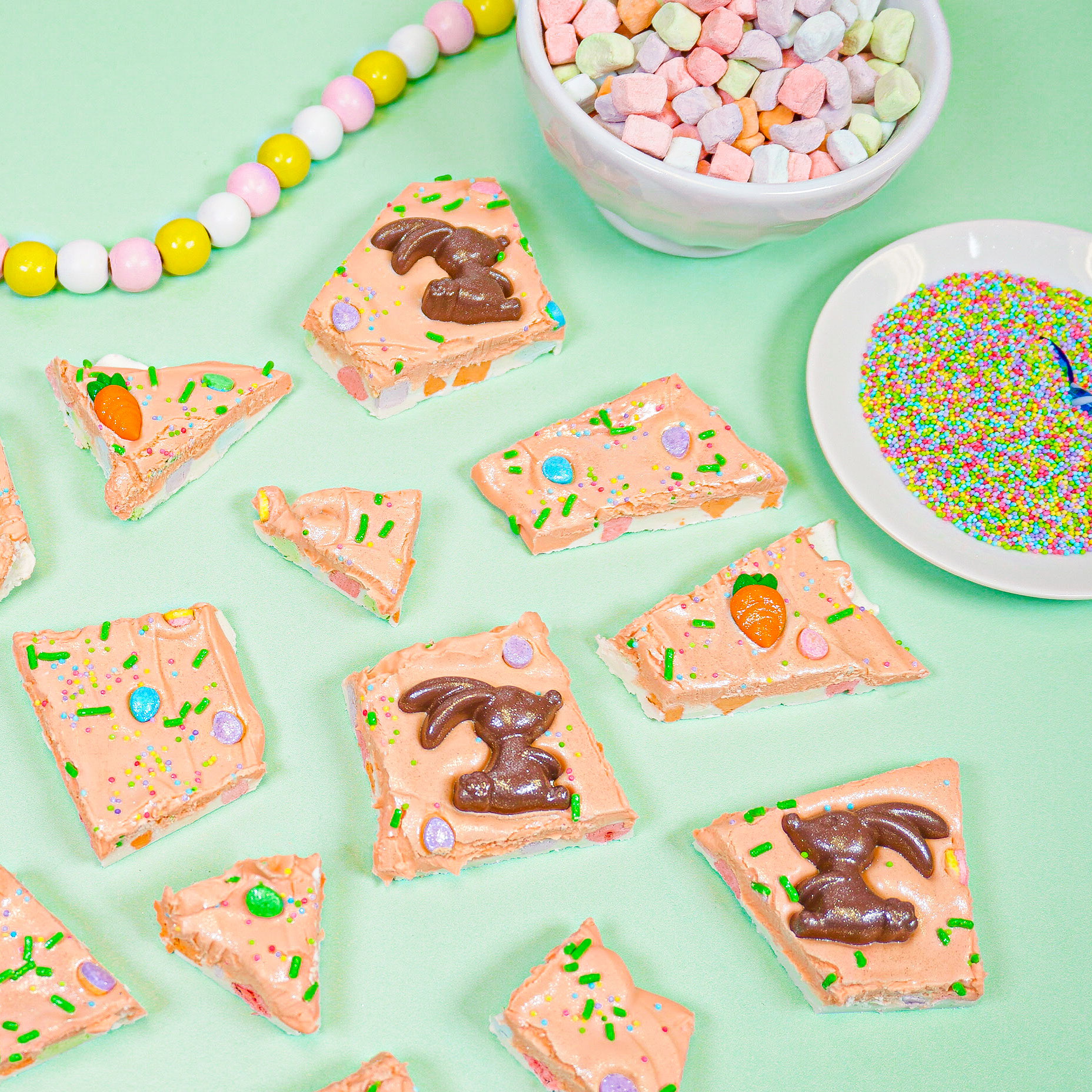 easter chocolate bark with a bowl of marshmallows and rainbow sprinkles