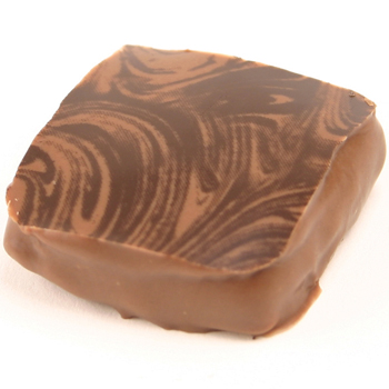 Cinnamon Ganache Chocolate with a swirl pattern from a chocolatr transfer sheet