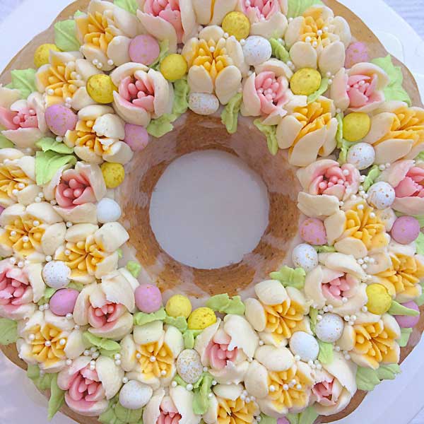 easter bundt cake topped with russian piped flowers