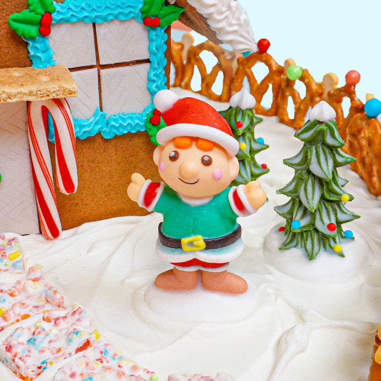 gingerbread house decorated with premade edible icing decorations