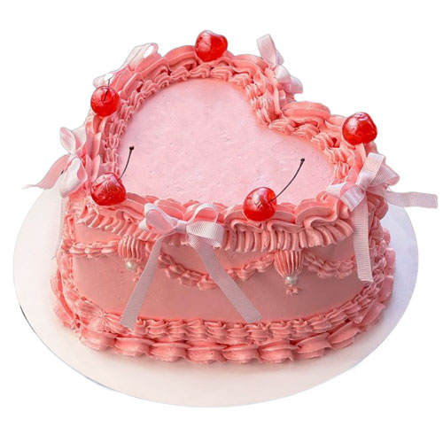 Vintage-style heart cake decorated with buttercream piping in an 8-inch heart cake pan