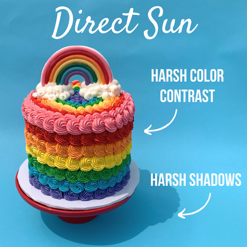 shot of a rainbow cake in direct sun - harsh shadows