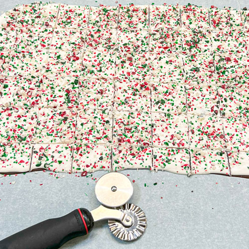 layered peppermint bark scored with pastry ruler