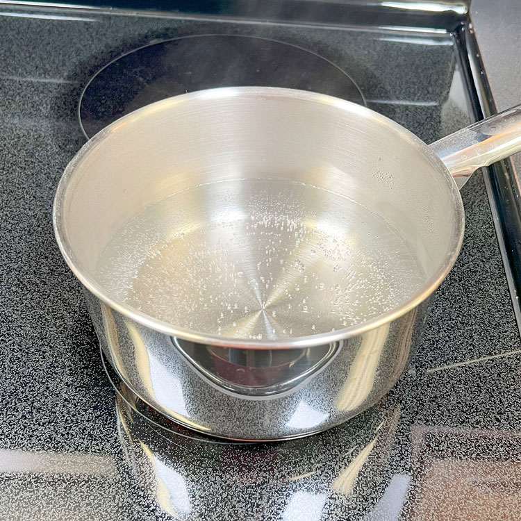 double boiler on the stove brought to a simmer