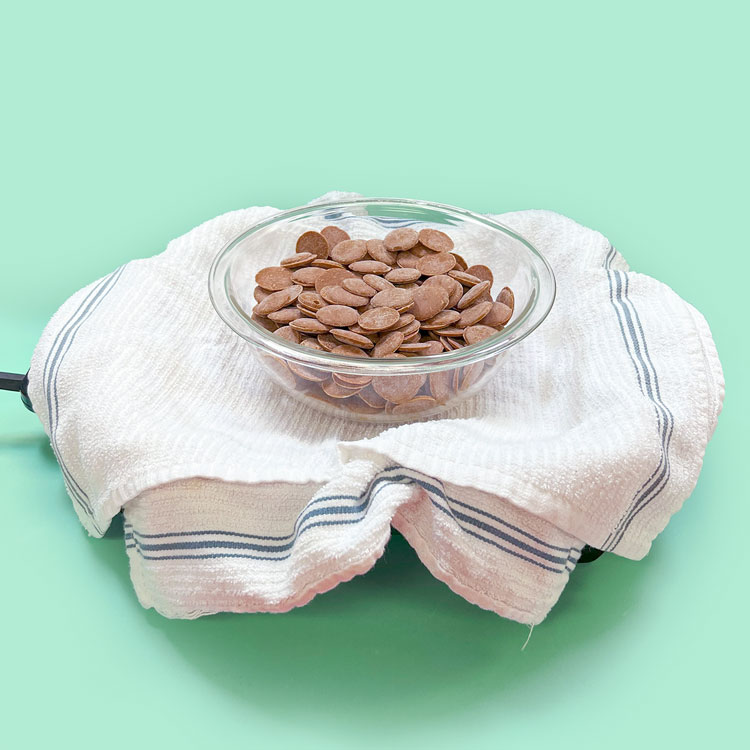 electric skillet lined with towels for melting chocolate