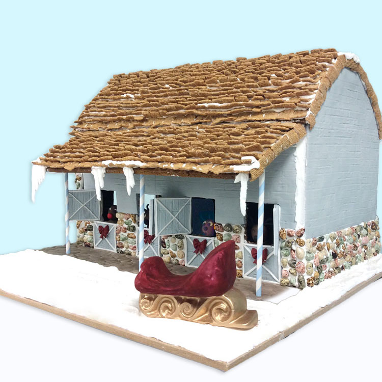 large blue gingerbread stable with fondant reideers