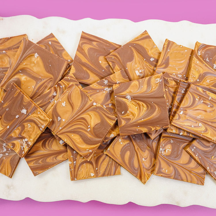 salted caramel bark on white platter