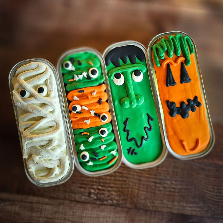 mini cakes decorated as a mummy, frankentein, jack-o-lantern