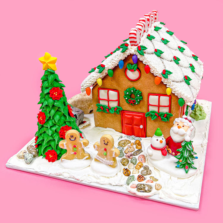 an assembled gingerbread house adorned with edible decorations from country kitchen sweetart.