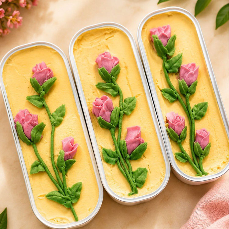roses piped onto mini loaf cakes