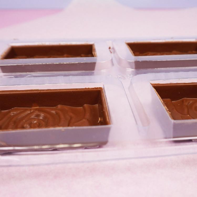 cleaned up chocolate bar shells ready to be filled with candy centers