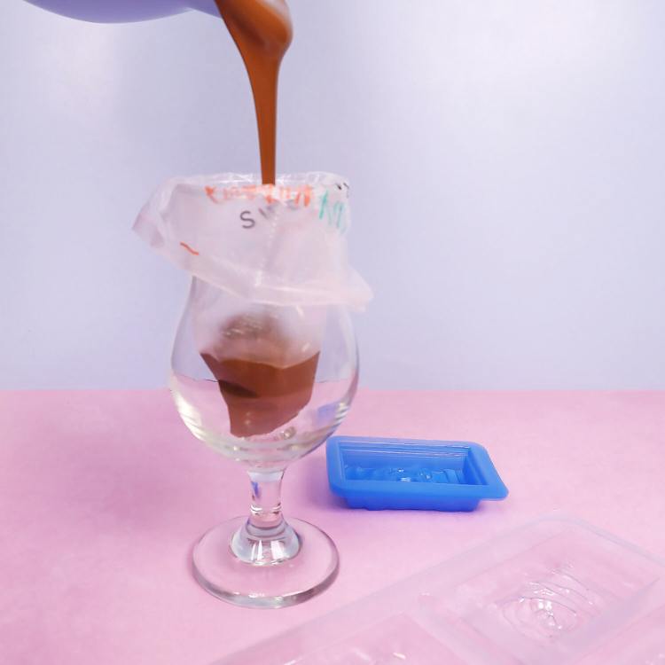 pouring melted chocolate into a tipless piping bag
