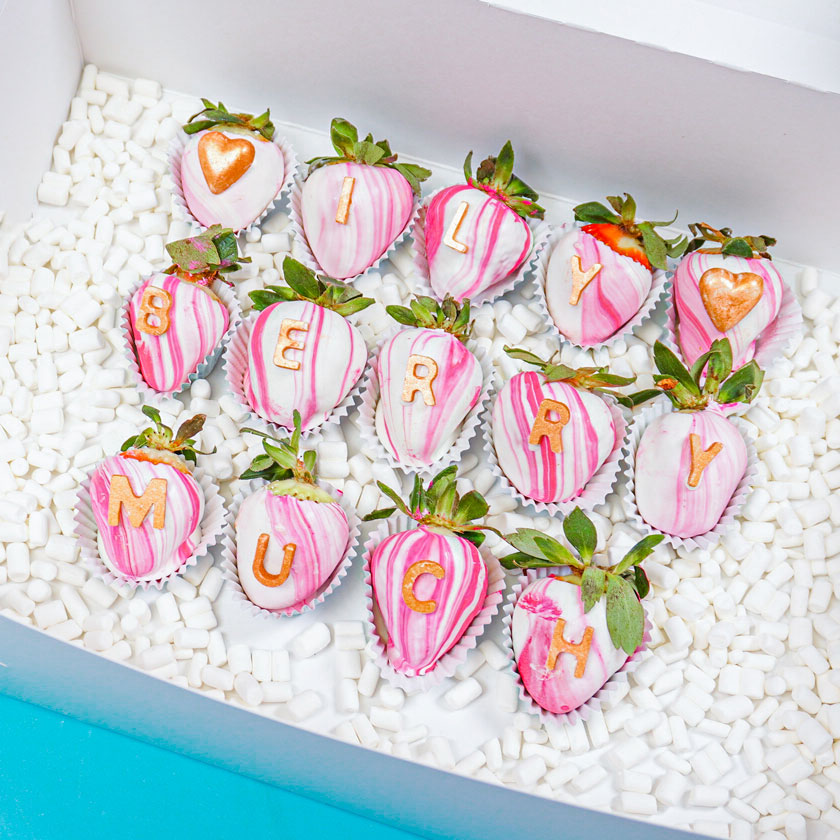 chocolated covered strawberries in a cake box with marshmallow filler