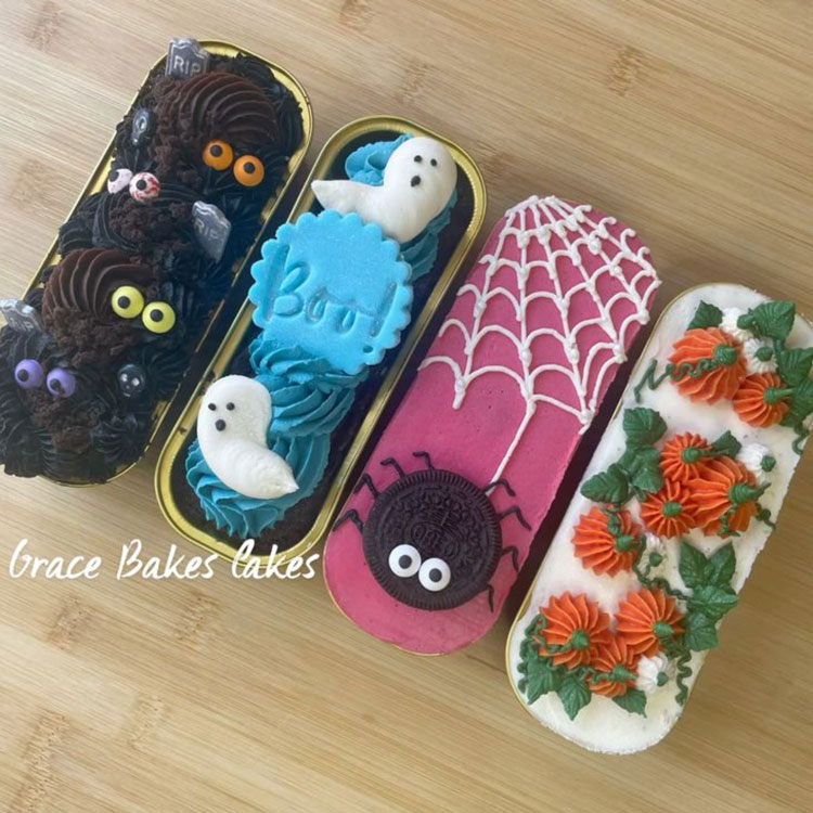 four different mini cakes decorated in halloween themes