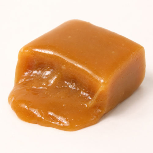 soft, runny candy center oozing out of cut, filled chocolate