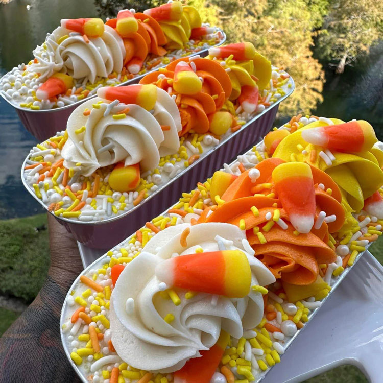 three mini cakes decorated with candy corn