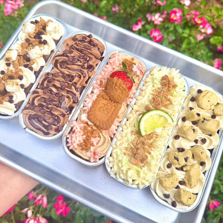 five mini loaf dessert cakes in flavors like cookie dough and strawberry
