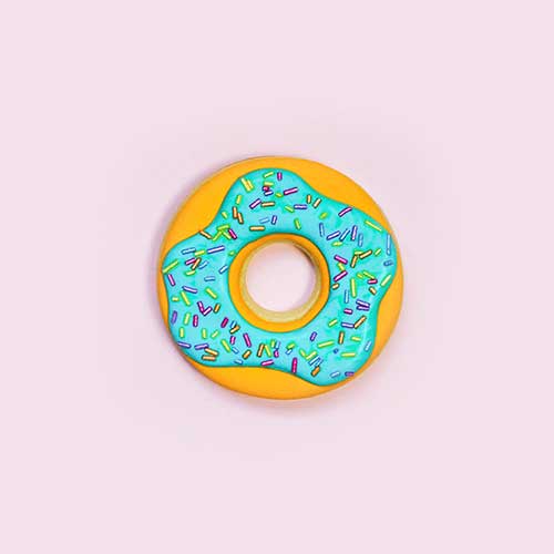 Royal Icing decorated donut cookie with colorful shimmer jimmies