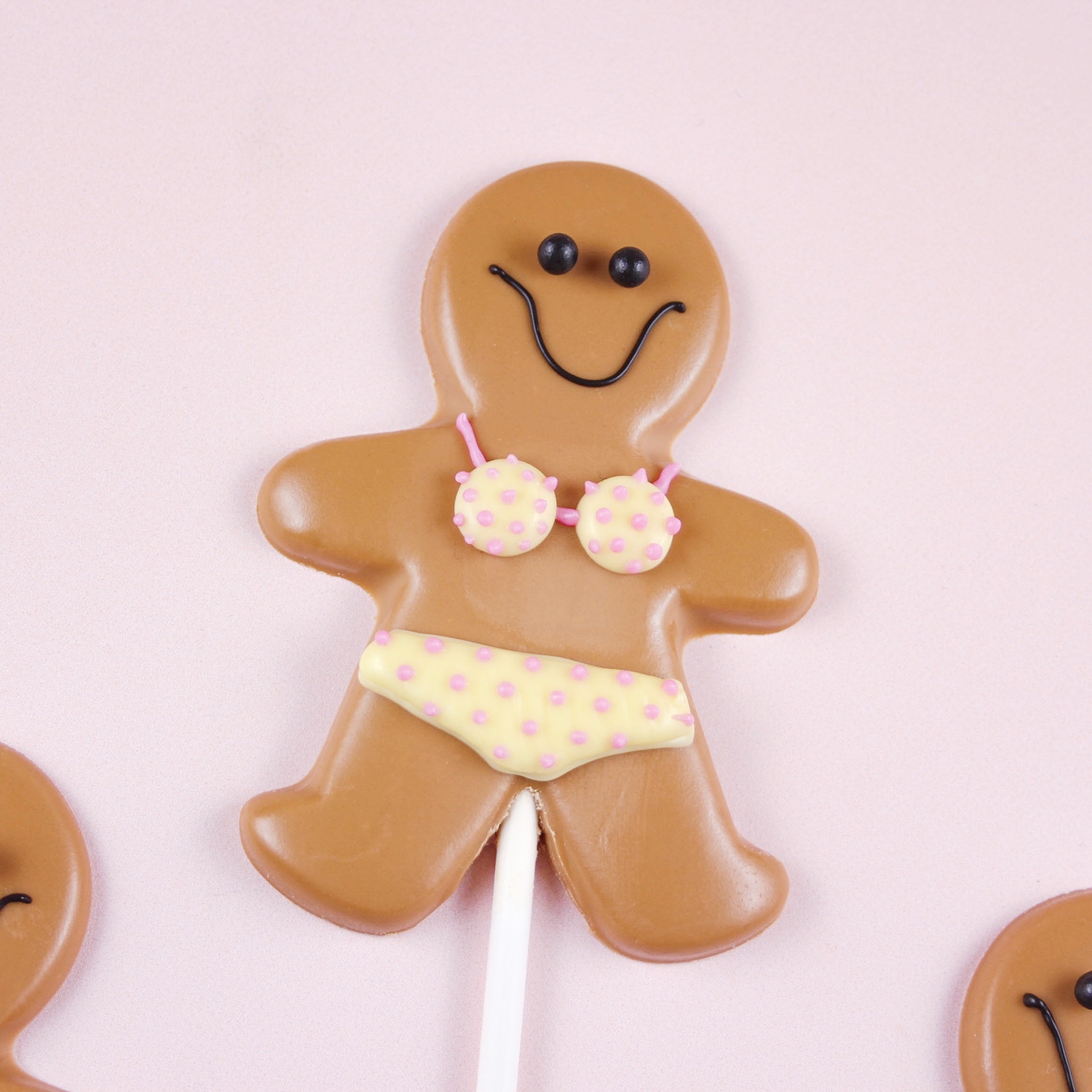 Molded Gingerbread Girl Chocolate pop wearing a bikini decorated with candy writers