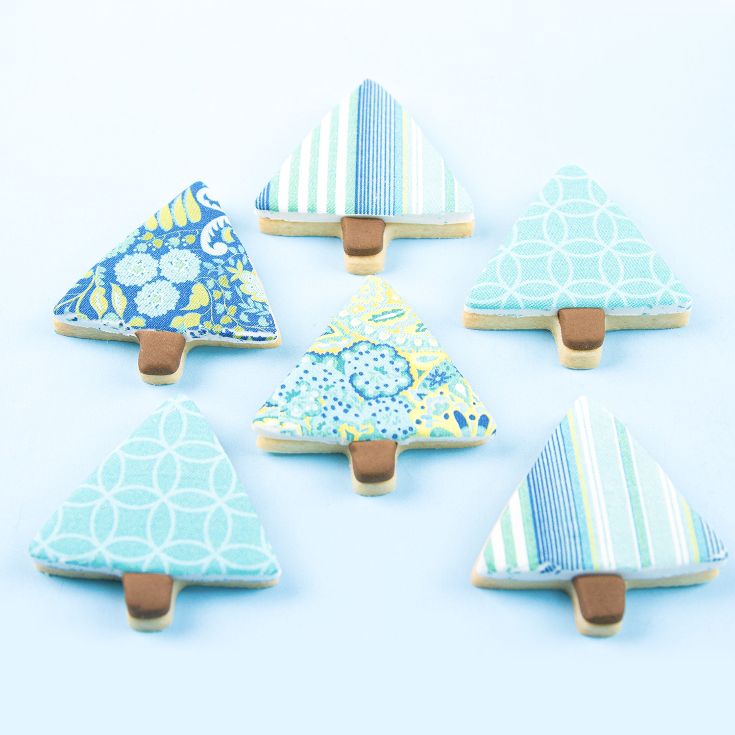 Striped, geometric and floral blue edible image patterned christmas tree cookies