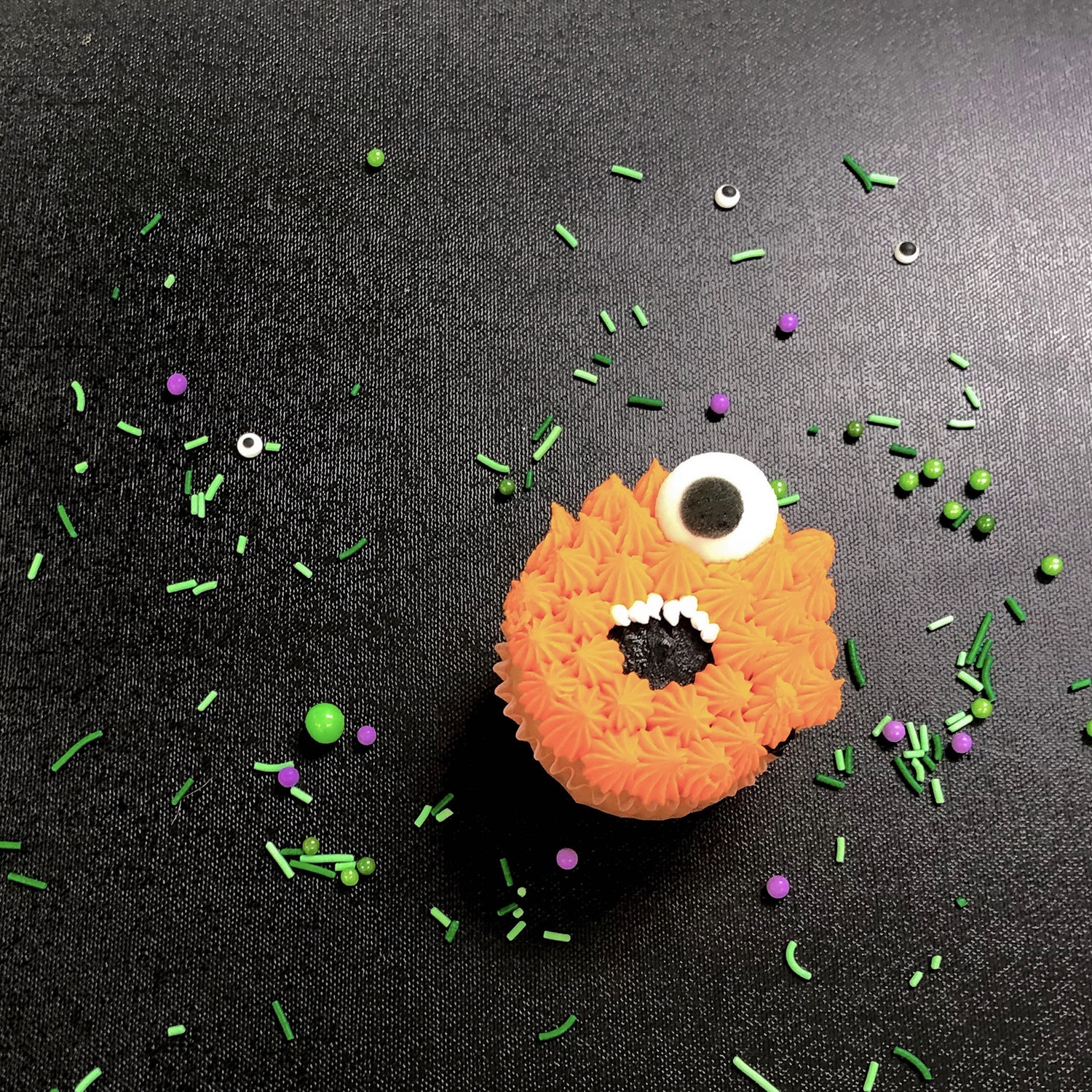One-Eyed Orange Monster Cupcake
