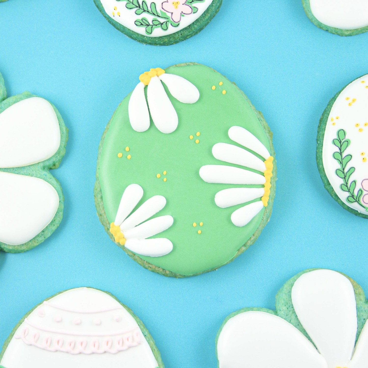 Blue Sugar Cookie Cut Out Egg decorated with royal icing daisy petals