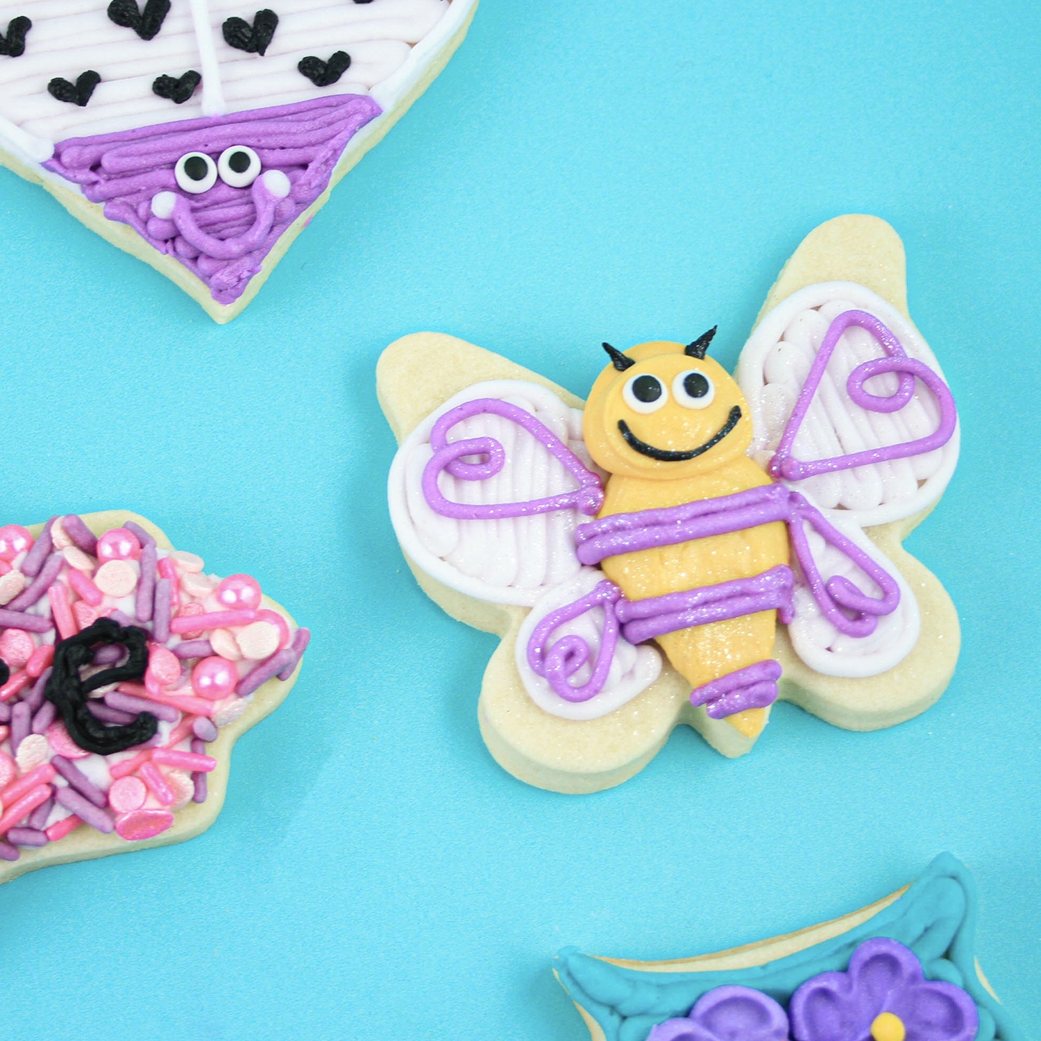 Butterfly cookie decorated in buttercream as a bumble bee for valentines day