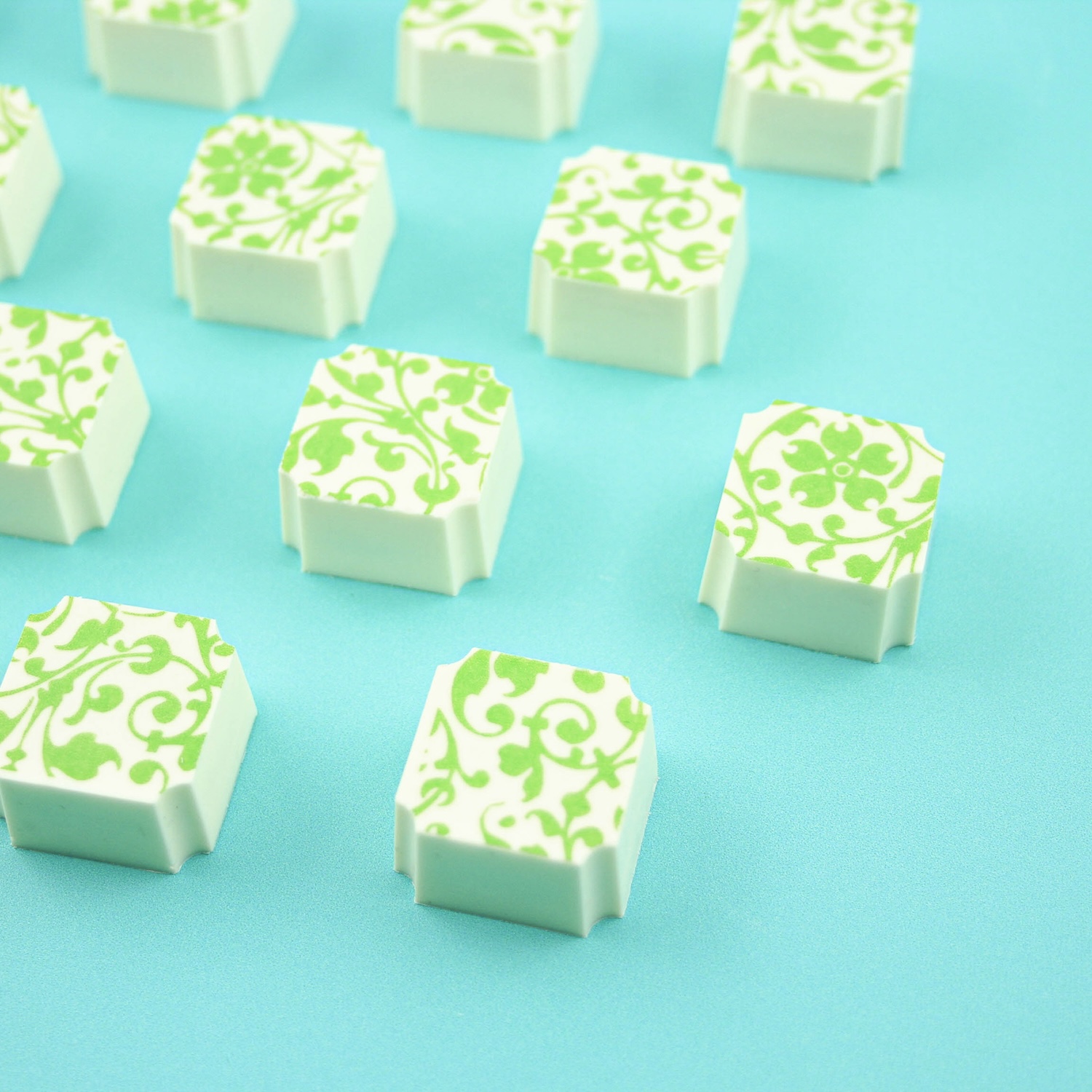White Chocolate creme de menthe filled bonbons with a green swirl transfer decoration
