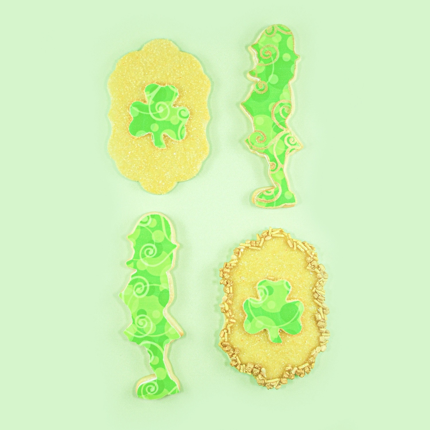 St. Patricks Day Edible Image Cookies of a Leprechan and a shamrock plaque cookie.