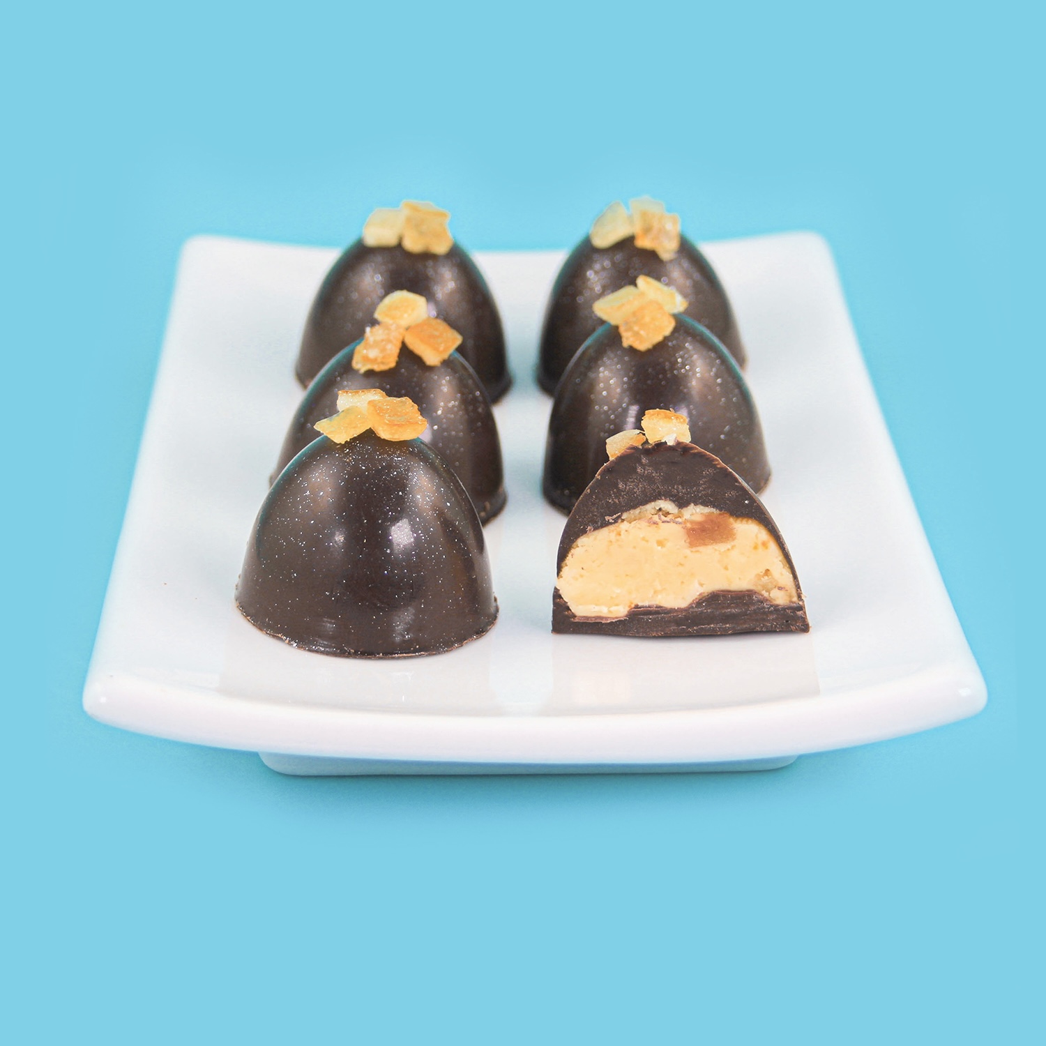 Chocolate Molded Orange Fruit Center Bon Bons showing orange candy center