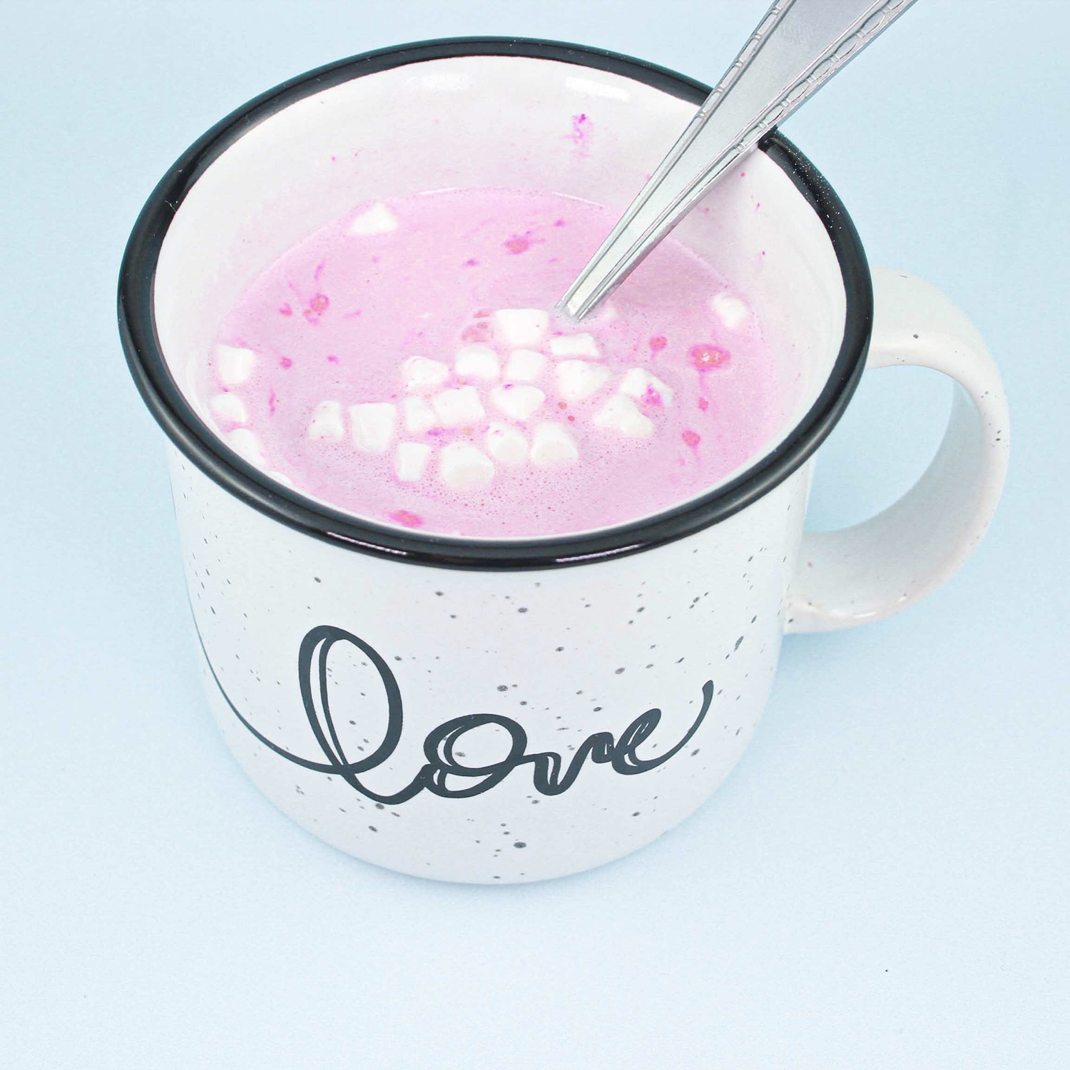 pink hot chocolate in a mug for gender reveal party