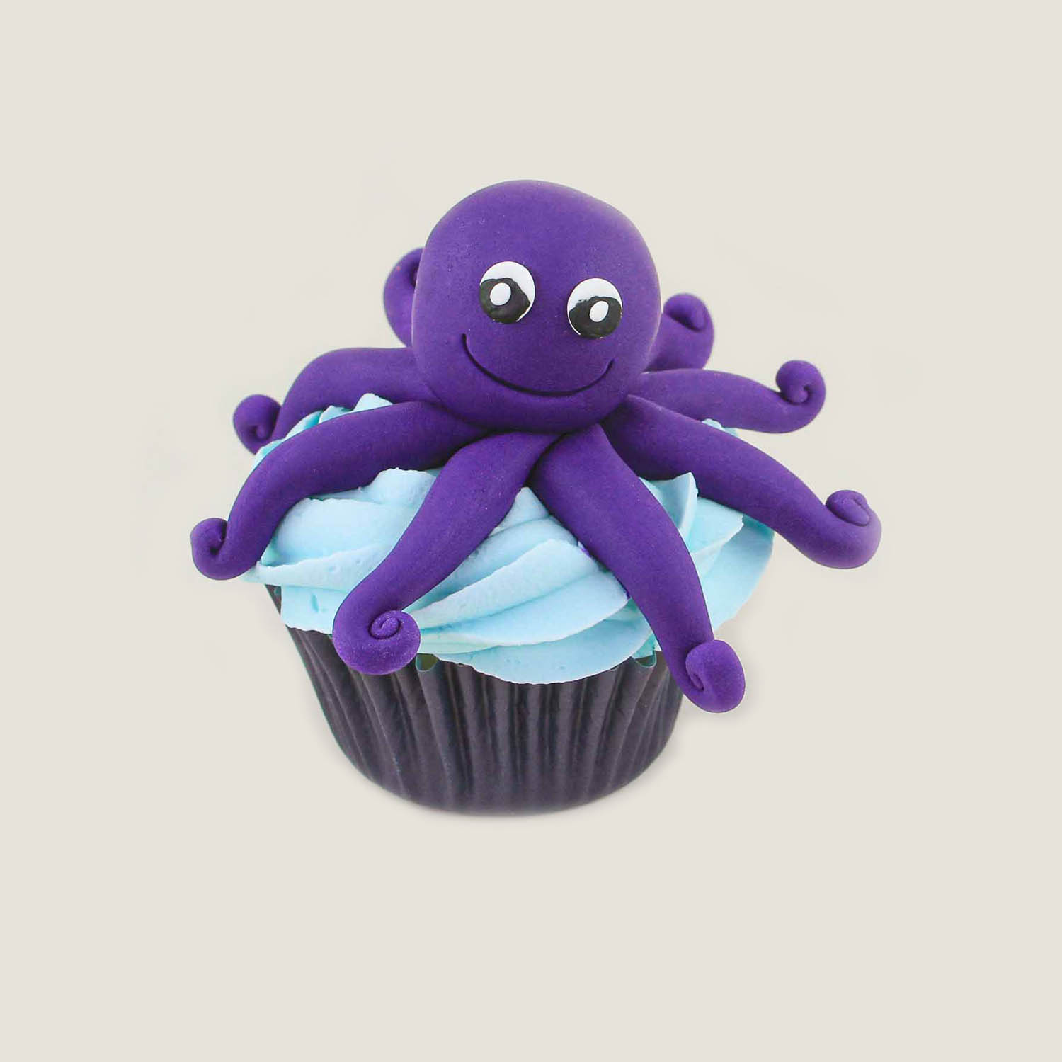 Hand sculpated fondant octopus cupcake topper