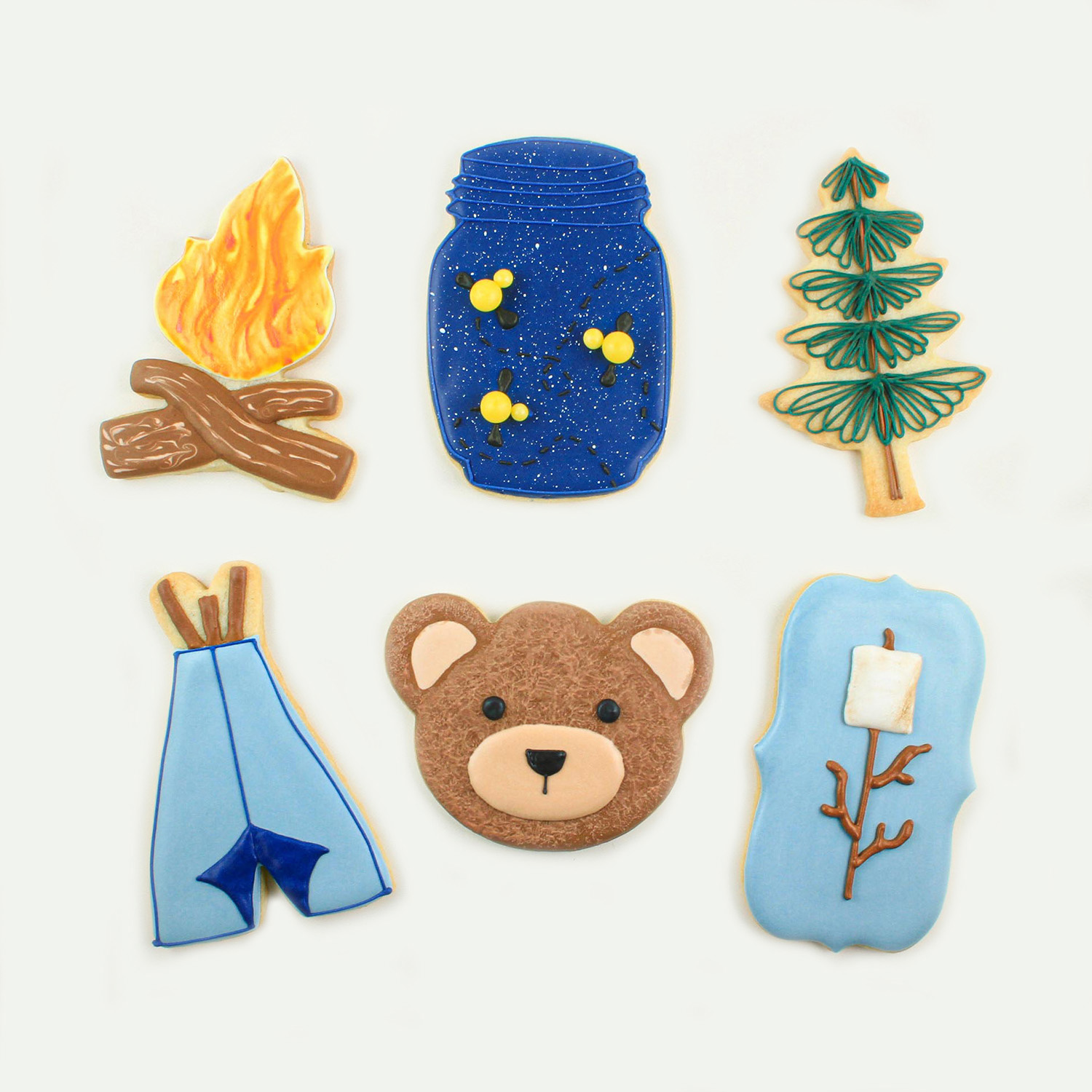  Bonfire, fireflies in mason jar, pine tree, tee pee, bear face and rosted marshmallow on a stick plaque cookies.