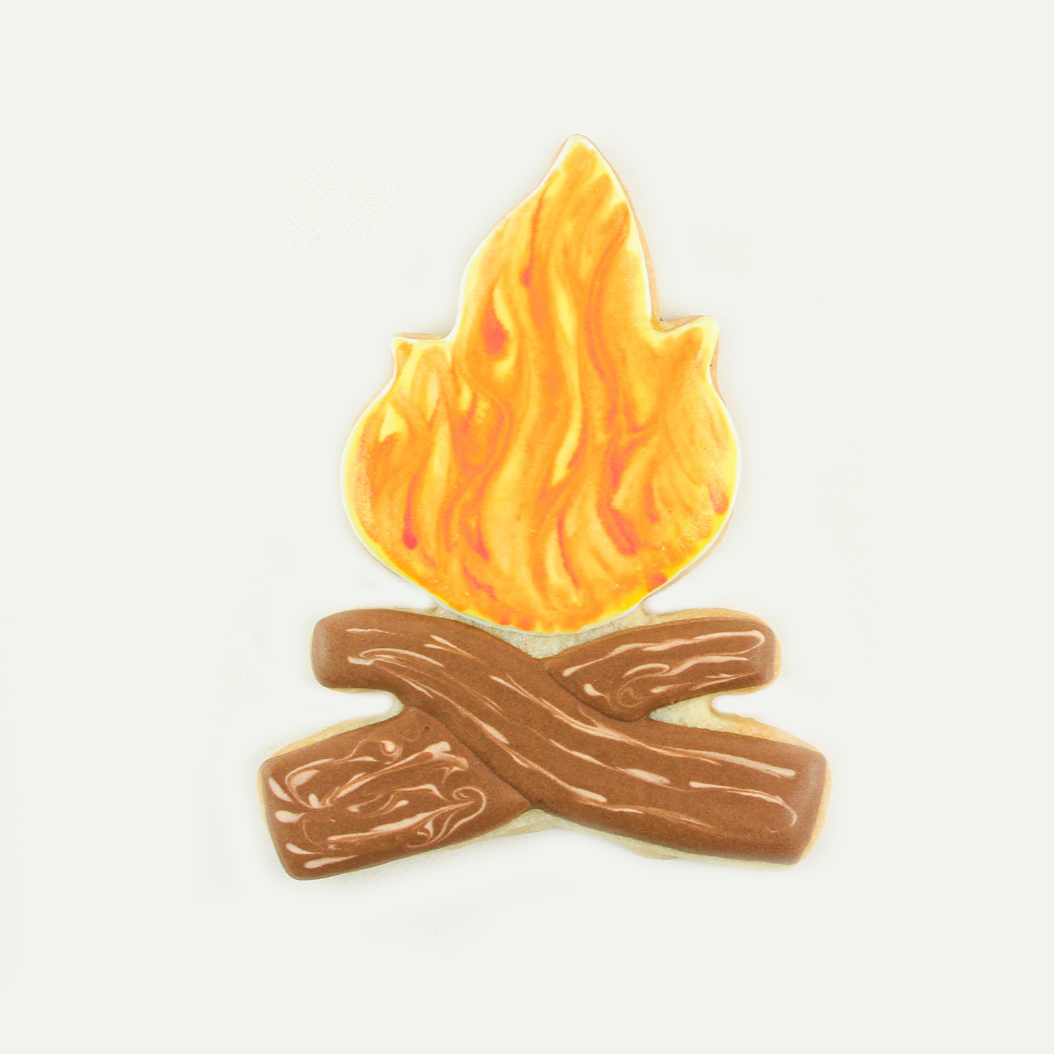 Bon fire cookie decorated in royal icing with brown logs and yellow and orange flames.