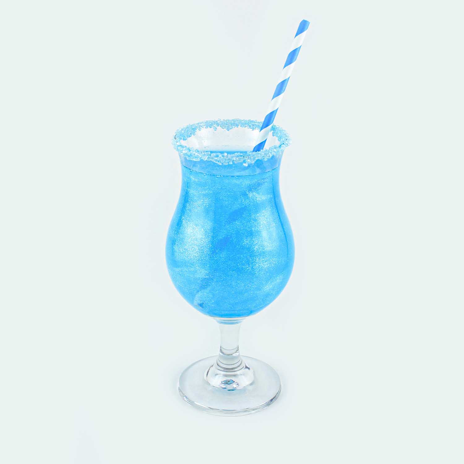 two blue raspberry drinks with glitter and sugar rim