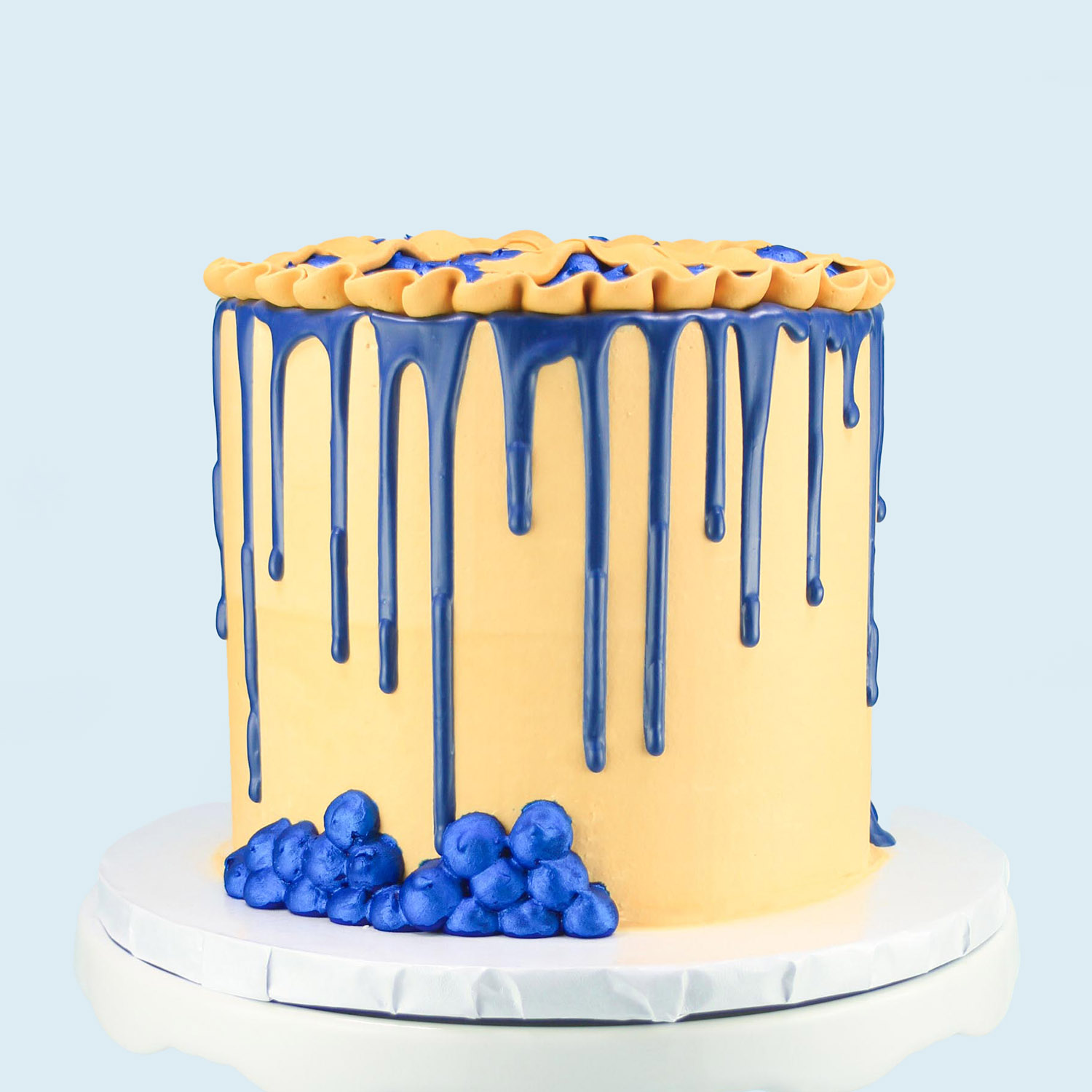 Blueberry drip on the side of the cake