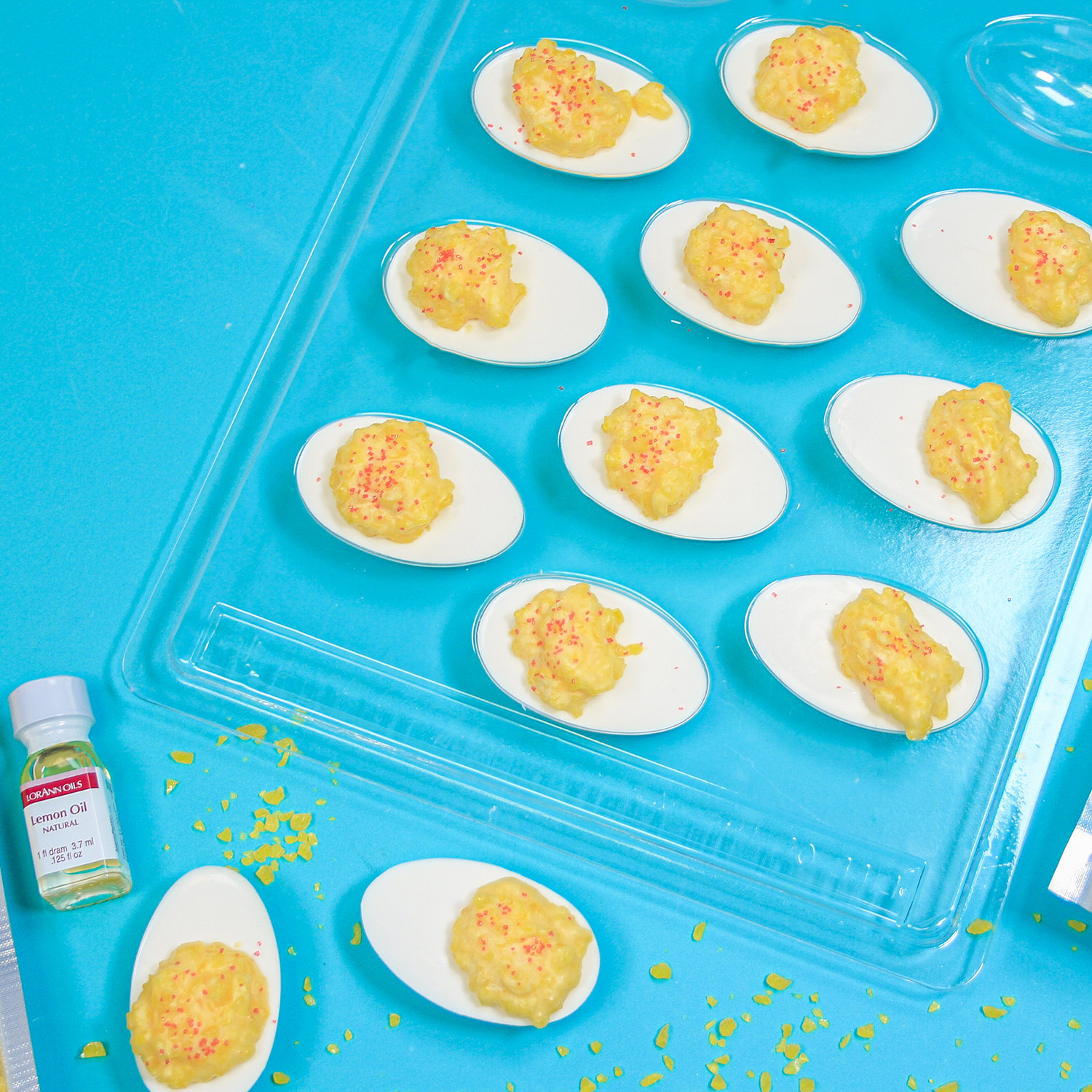April Fools Deviled Eggs made with candy coating, lemon crunch and red sanding sugar.