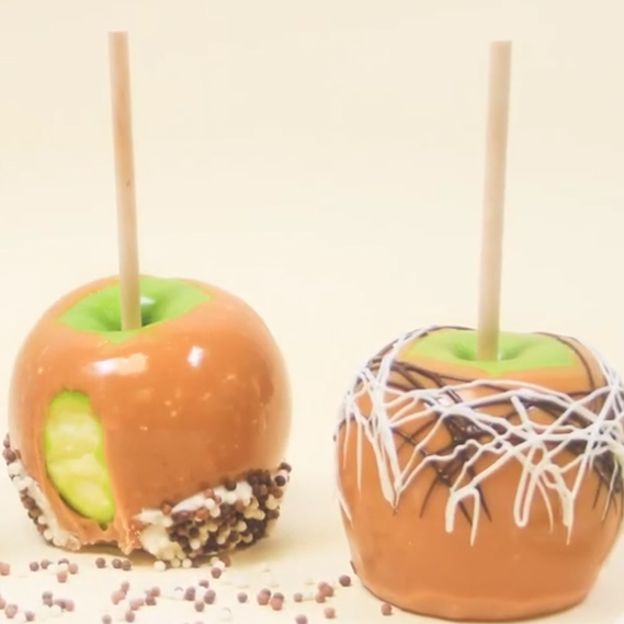 two caramel apples made with premade peter's caramel