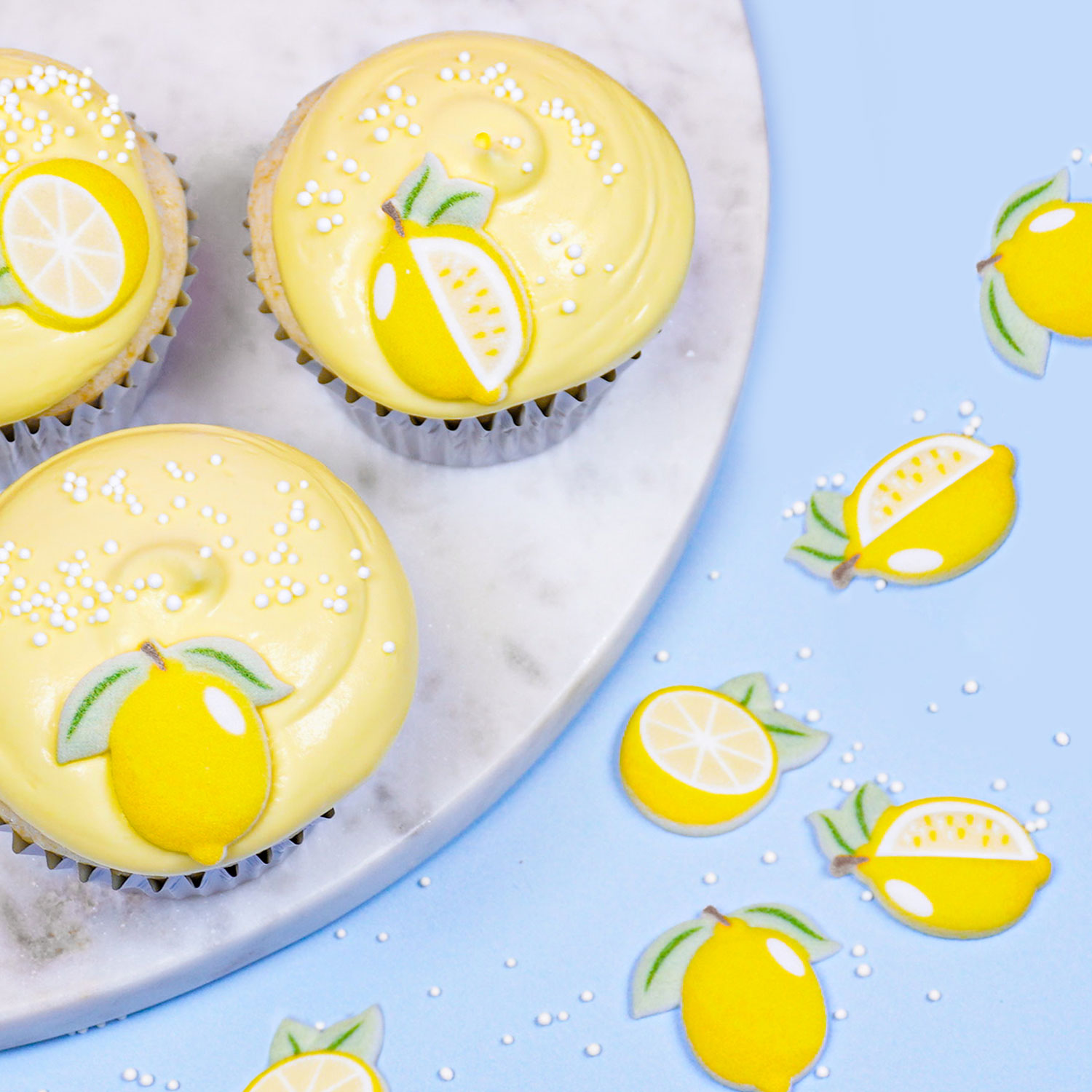 lemon blueberry cupcakes decorated with lemon icing decorations