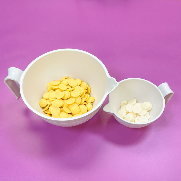 bowls of yellow and white candy melts