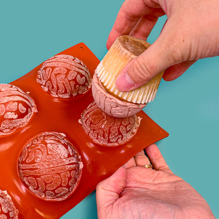 removing brain cupcakes from hemisphere mold
