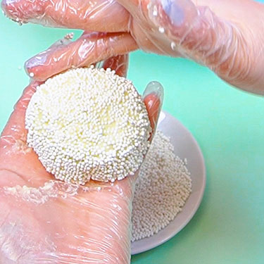 shaping cheeseball with hands