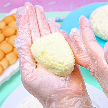 shaping cheeseball with hands