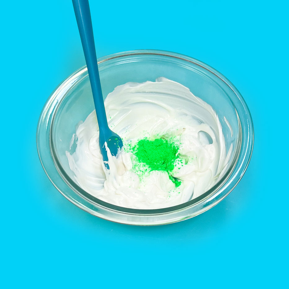 melted white chocolate with green rolkem powder