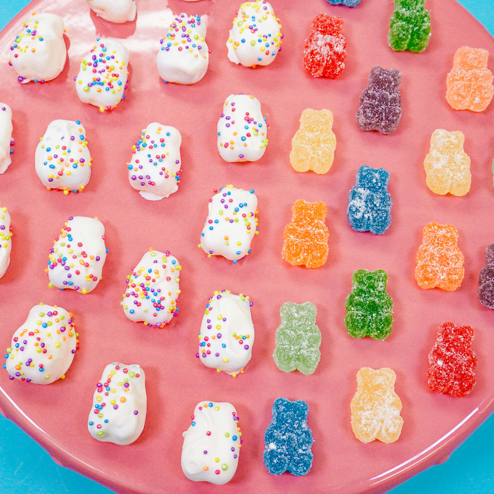 sour gummy bears covered in white chocolate and rainbow sprinkles