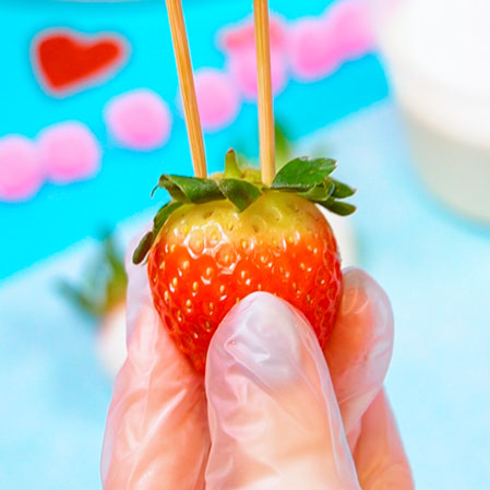 strawberry with skewers in the top