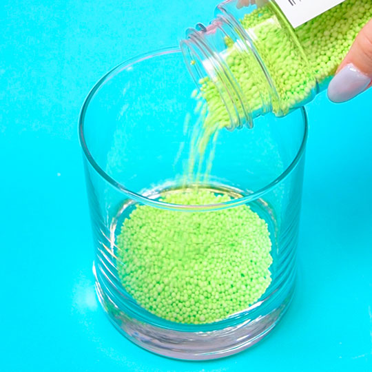 green sprinkles in a cup