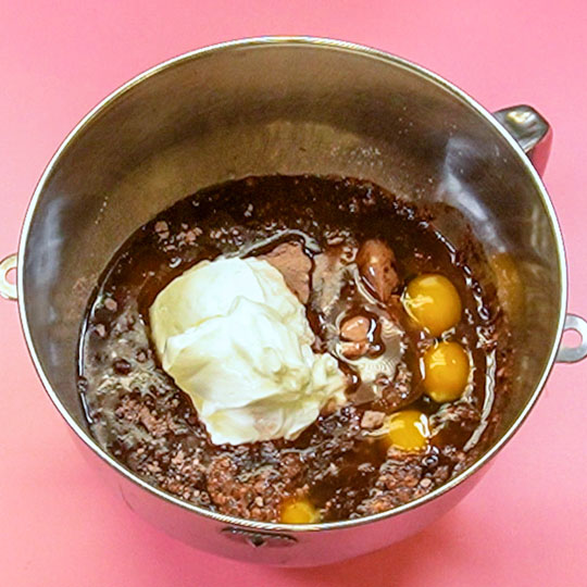 ingredients for chocolate cake in a mixing bowl