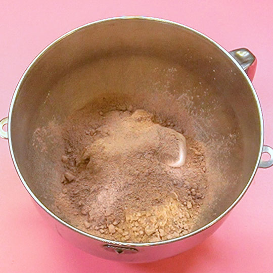 mixing bowl with chocolate cake mix and instant chocolate pudding