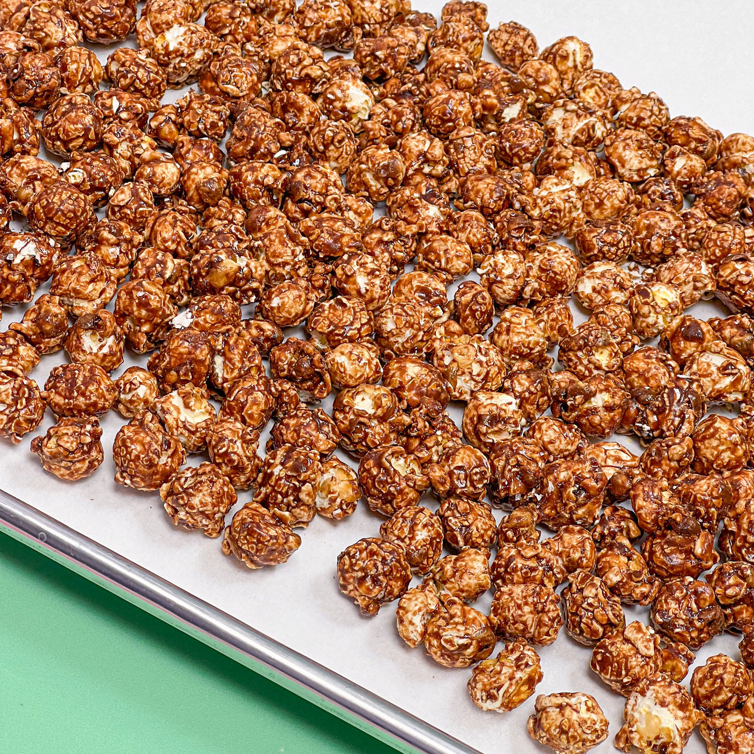 popcorn spread on parchment paper